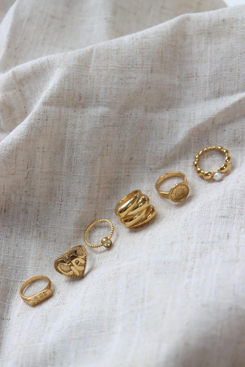 Braided green ring gold